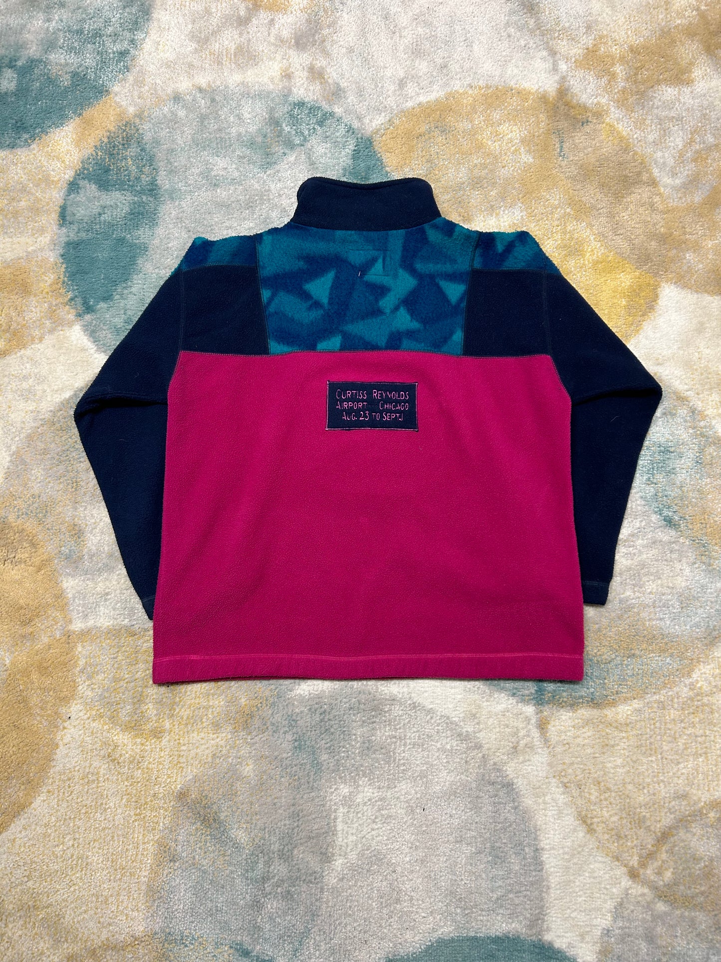 Retro magenta and blue patterned fleece half-zip