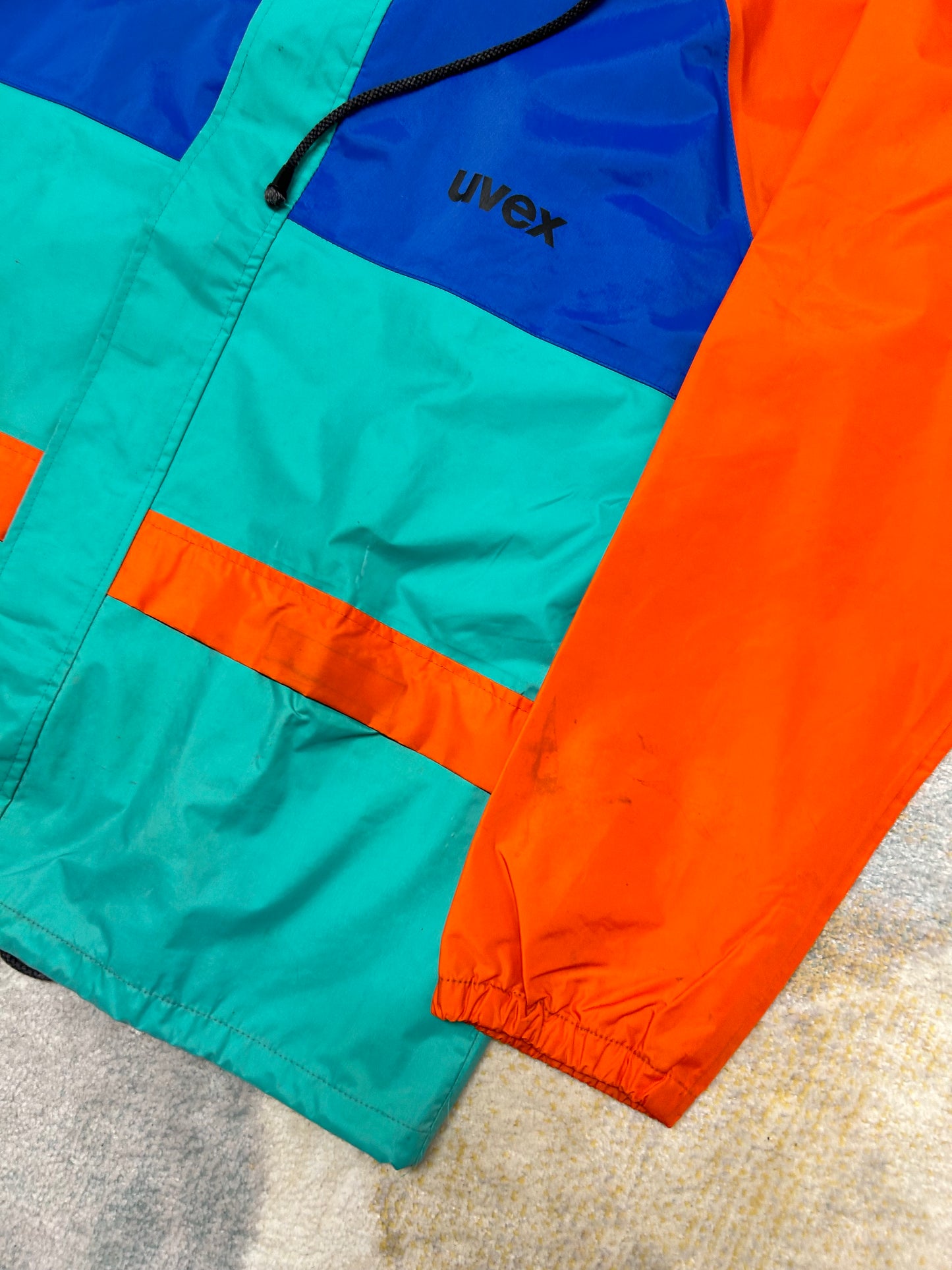 Orange cyan and blue Windbreaker